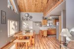 Knotty Pine Chalet with lots of windows and forest views.